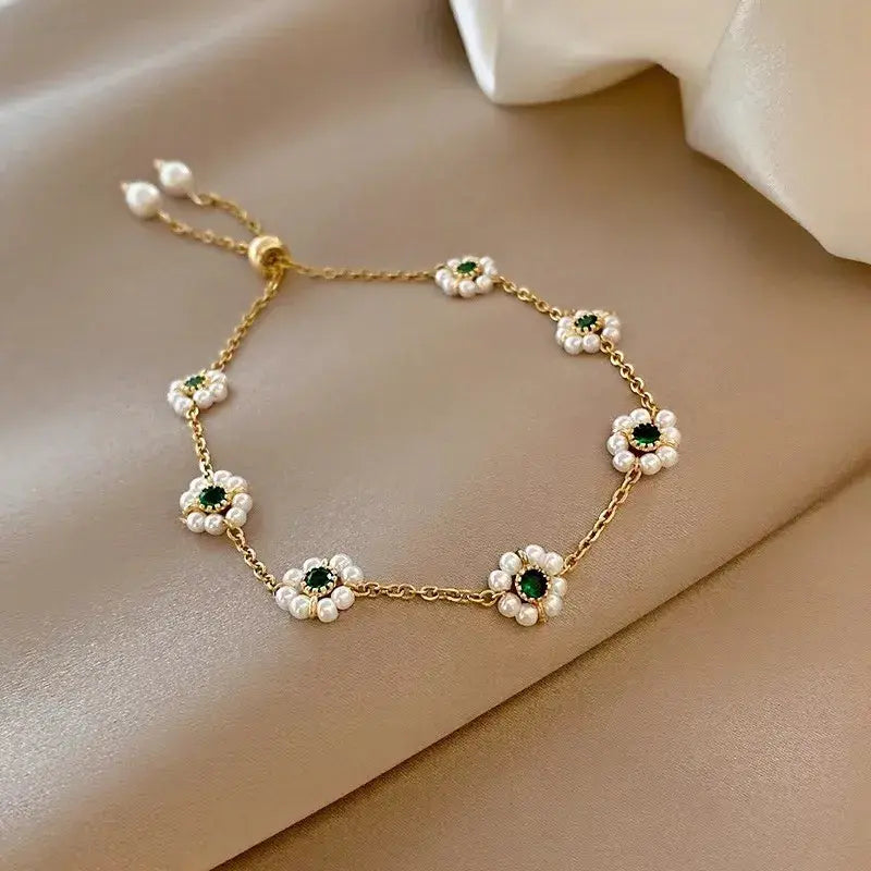 Daisy-Inspired Gold Bracelet with Green Crystals